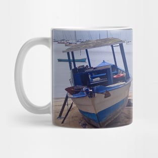 Boats stopped at the beach on a rainy day Mug